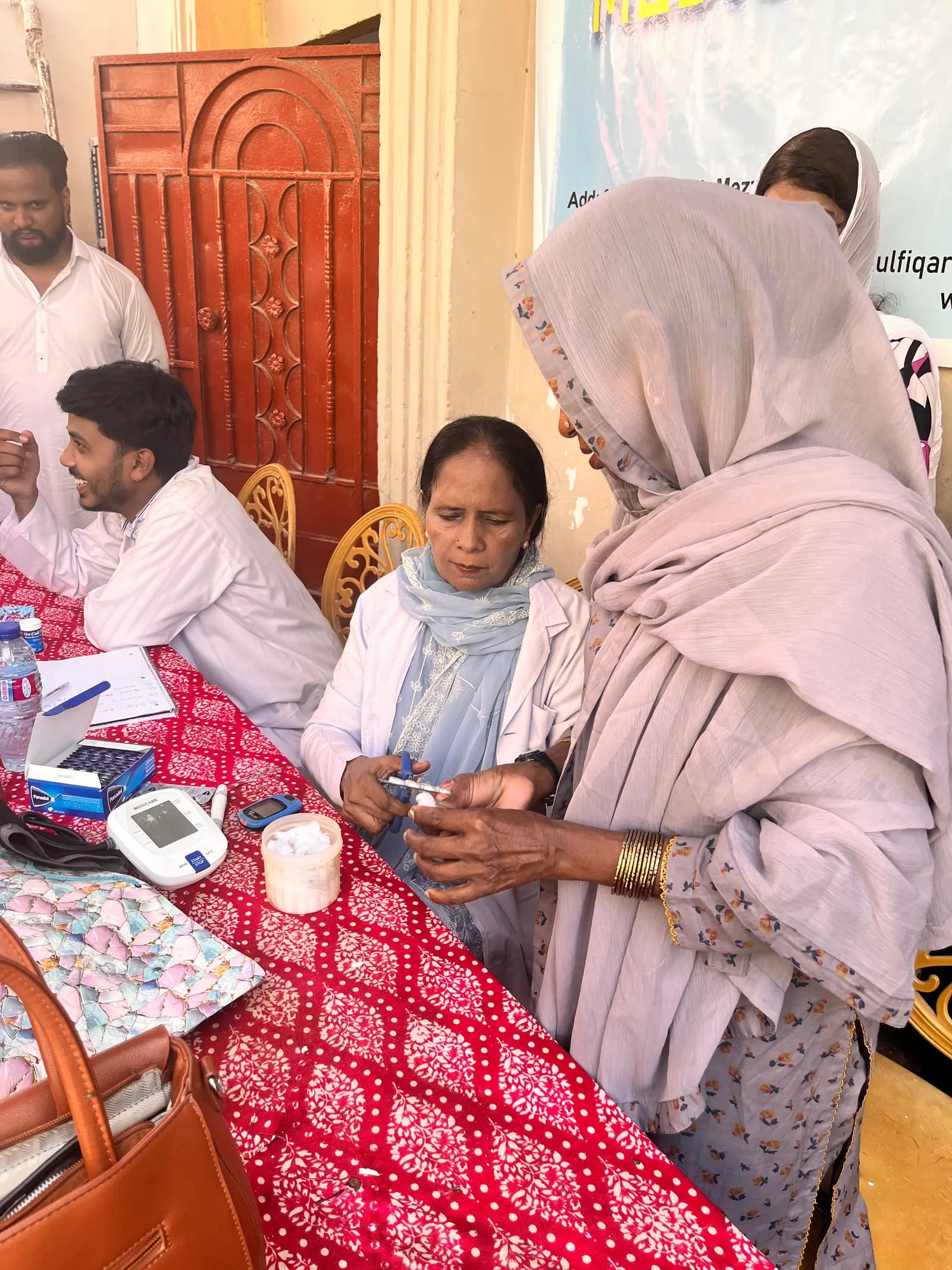 Community members receiving medical support
